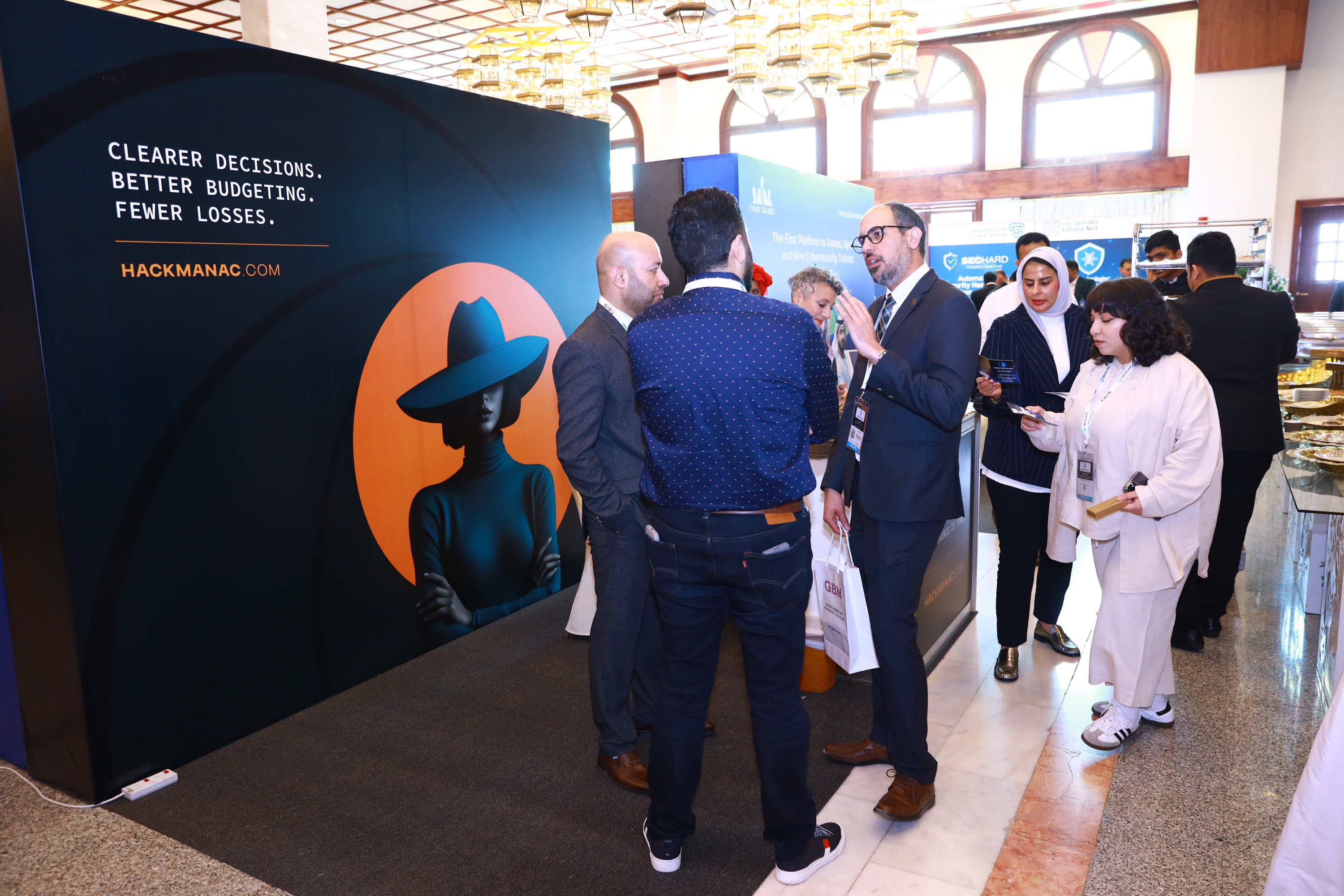 Delegates meeting at an exhibitor stand